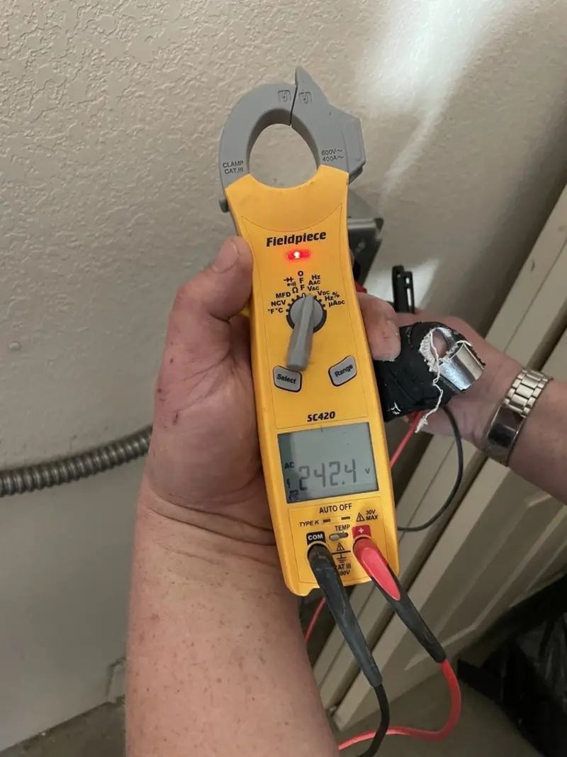 Voltage testing with clamp meter during Electrical Installation Services in Beech Grove